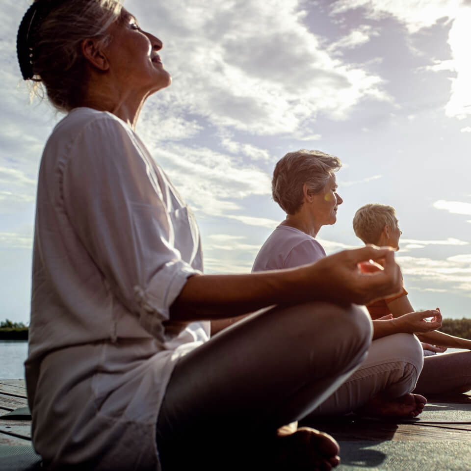 Woman in group meditation